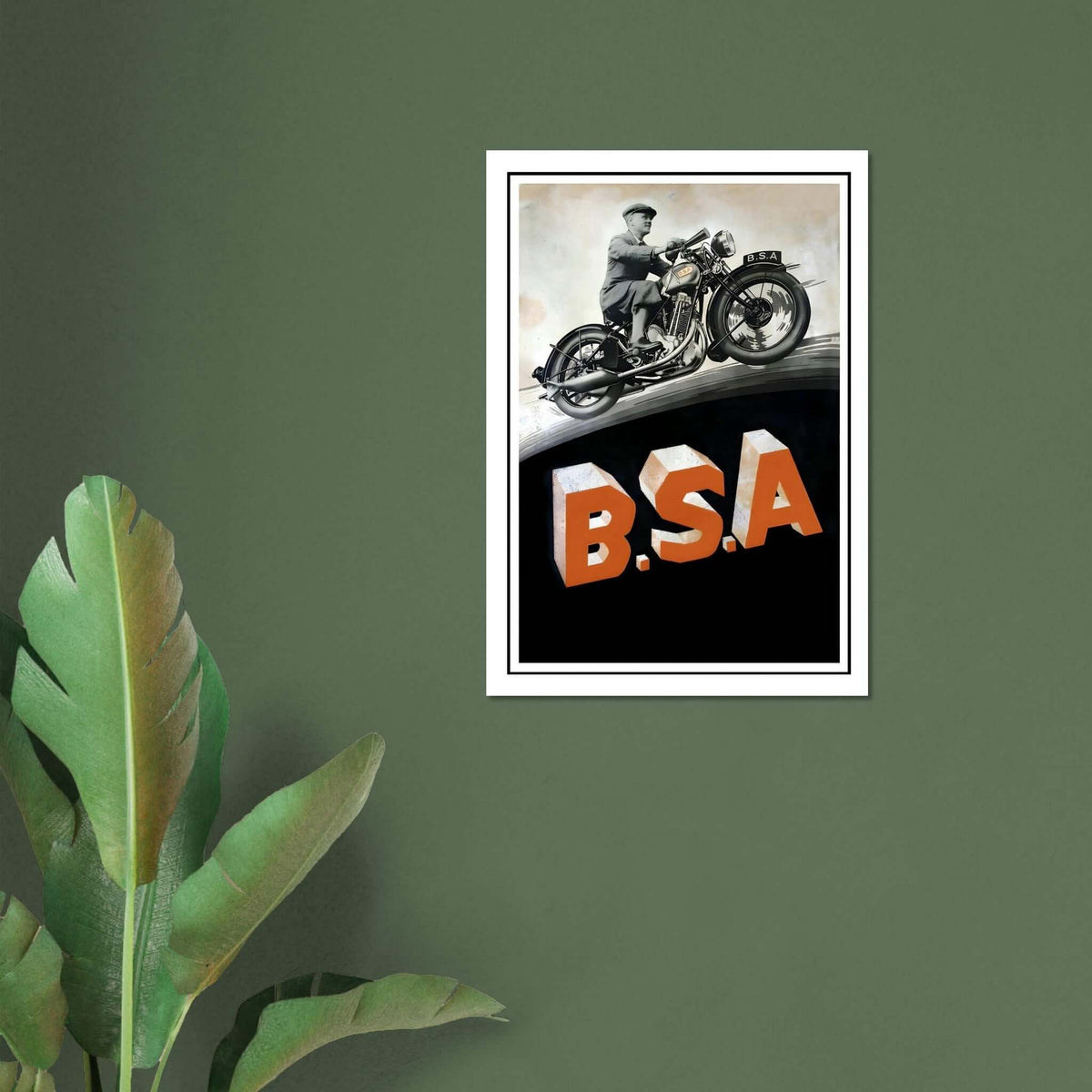 Classic BSA motorcycle poster featuring a man on a motorcycle above bold B.S.A. letters.